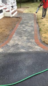 beautiful permeable pavers walkway outside the house